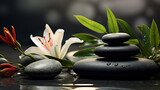 Beautiful lily flower and stack of stones on water surface