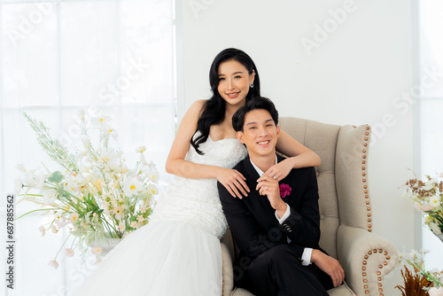 Groom and bride together, exuding elegance and joy in a bright wedding portrait setting - Pre wedding posed for photography