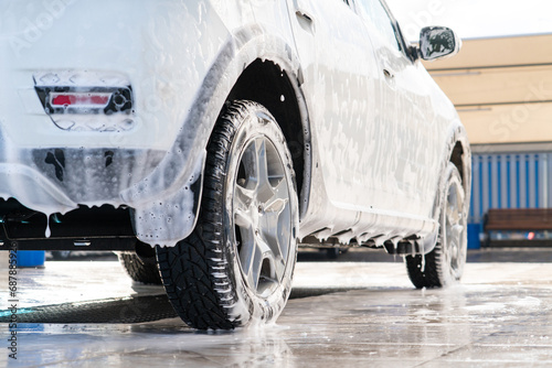 Self service high pressure car wash. Vehicle covered with foam © scharfsinn86