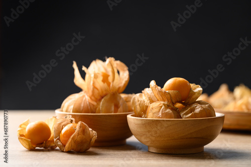 Cape gooseberry, Goldenberry or Physalis peruviana in bowl with black background photo