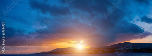Fototapeta Naklejka Na Ścianę i Meble -   Tranquil sunset over dramatic ocean storm with panoramic sky