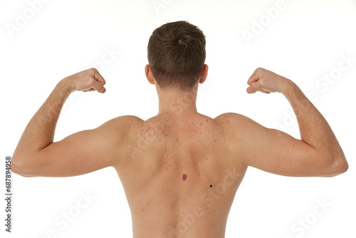 young man showing his bicep over white background. Rear view. perfect body shape