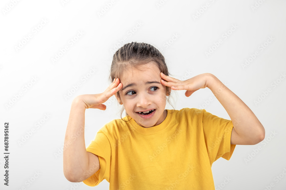 Little desperate girl looking panic, holding her head with both hands. Little desperate girl looking panic, holding her head with both hands.
