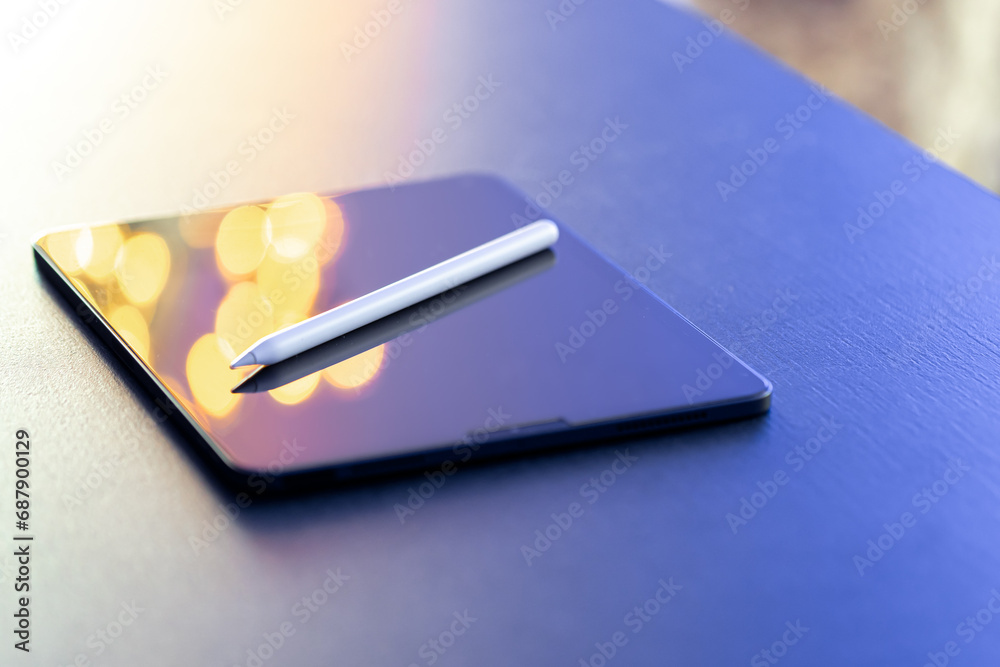 Digital tablet and stylus pen on the table close-up. Digital tablet and stylus pen on the table close-up.
