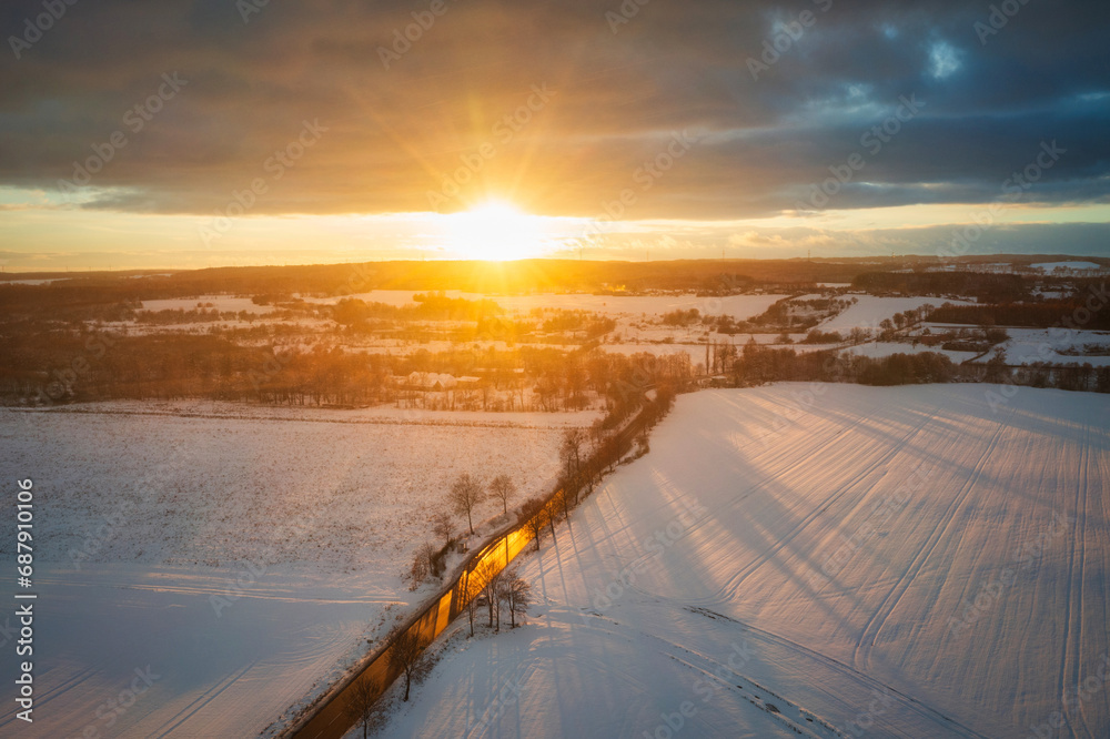 Aerial landscape of the road through snowy field at winter, Poland. Aerial landscape of the road through snowy field at winter, Poland.
