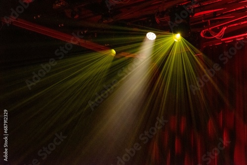clolorful spotlights with light rays photo