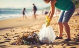 Volunteers clean and pick up trash on the beach to prevent flood disasters and infectious disease outbreaks