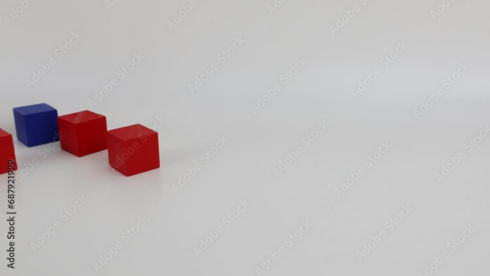 Close-up of wooden cubes, red and blue colors, with side view. Close-up of wooden cubes, red and blue colors, with side view.