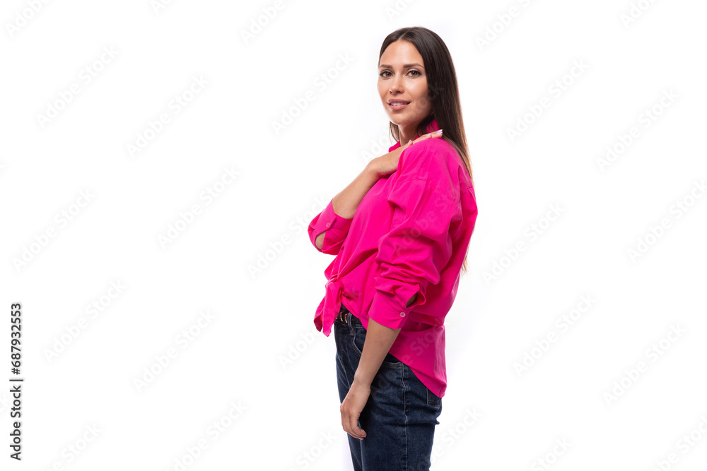young confident strong brunette woman leader wears a bright pink shirt on a white background