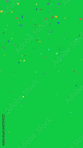 4K vertical. seamless looping of particle animation of colorful confetti falling down decoration for party celebration isolated on chroma key green screen background for overlay motion graphic