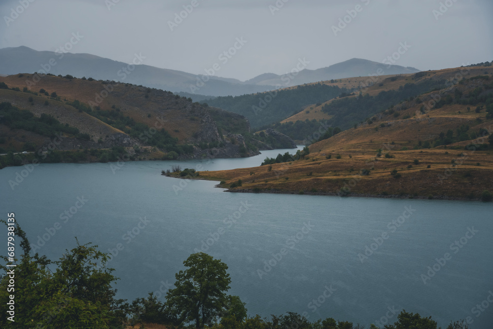 Autumn landscape, lake in cloudy weather