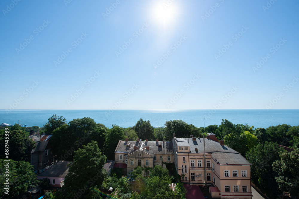 Odessa, Ukraine. Landscape with the sea, sun, trees and old buildings, bird's-eye Odessa, Ukraine. Landscape with the sea, sun, trees and old buildings, bird's-eye