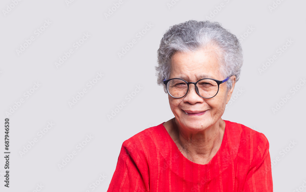 Beautiful senior woman with short white hair and glasses smiles at the camera Beautiful senior woman with short white hair and glasses smiles at the camera