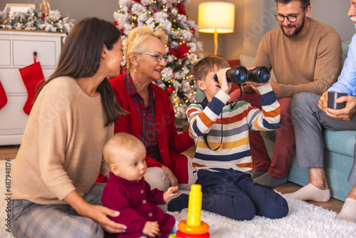 Multi-generation family spending Christmas day together at home