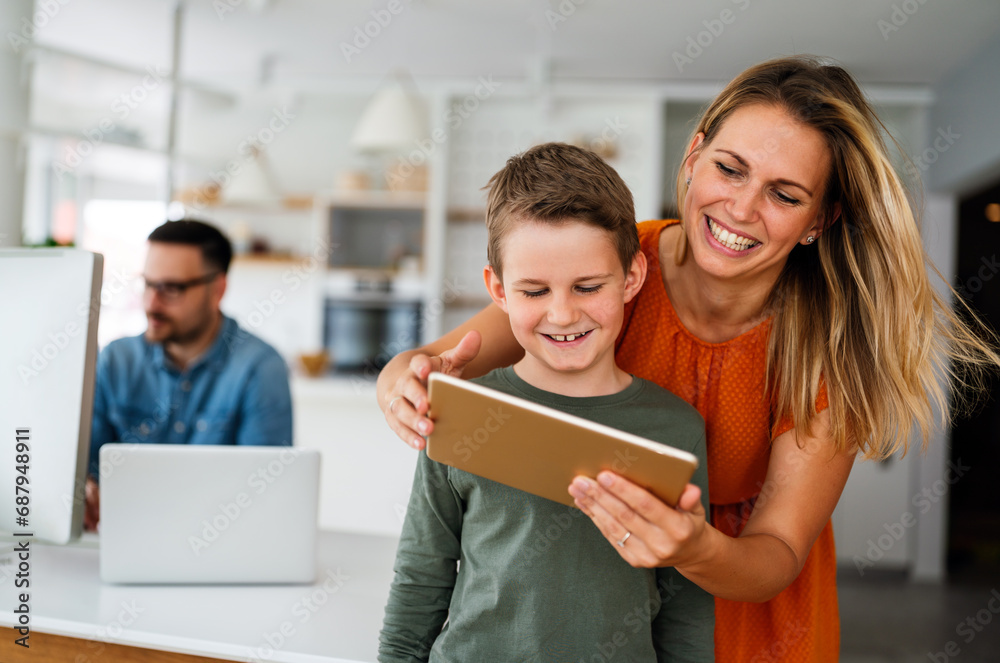 Mother and child using digital tablet for e-learning. Education home digital device kid concept. Mother and child using digital tablet for e-learning. Education home digital device kid concept.