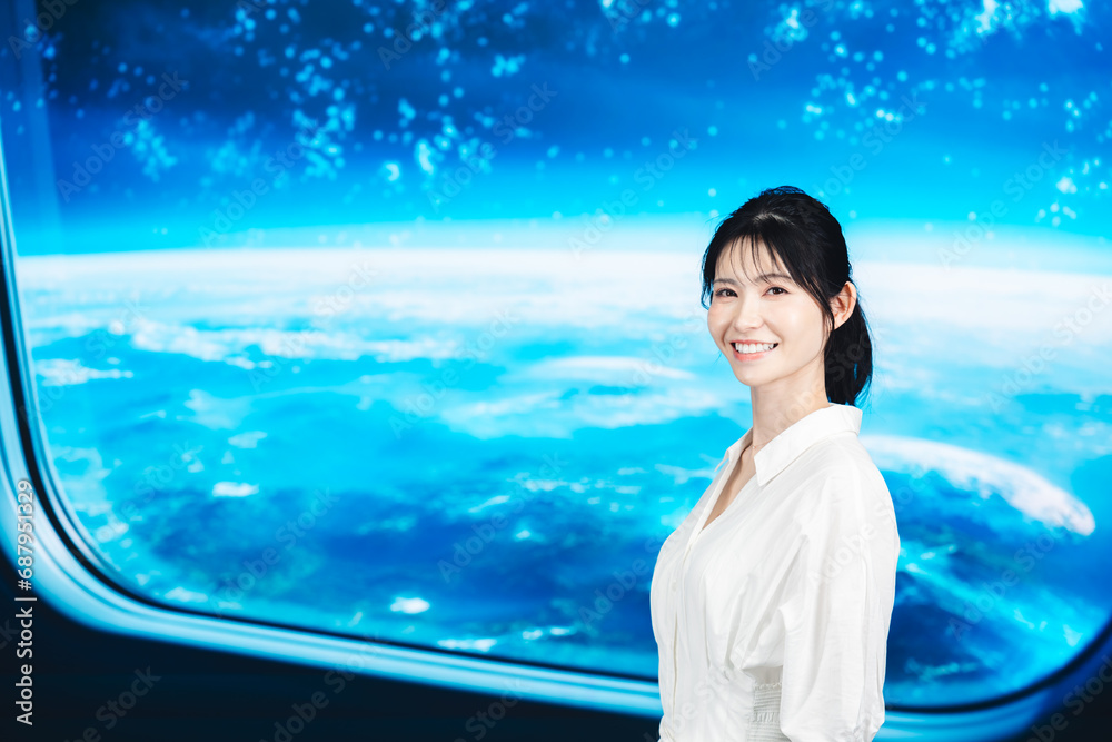 Fototapeta premium 宇宙旅行を楽しむ若い女性