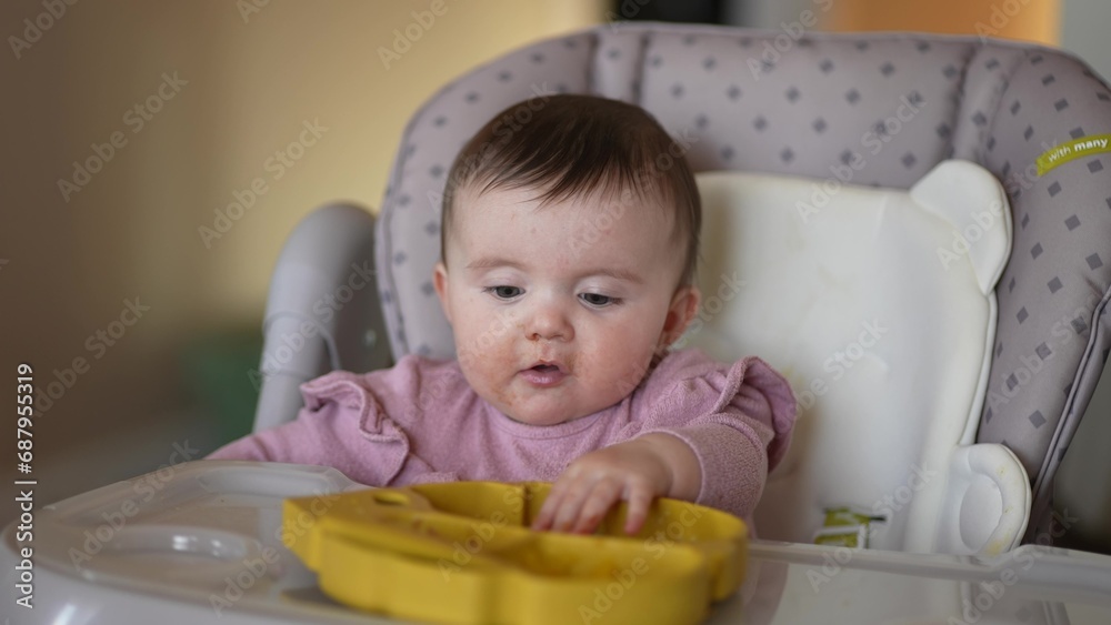 baby newborn eats. happy family dream weaning concept. dirty mess baby girl eating vegetables. baby daughter eats on a feeding chair dirty face. naughty dirty babe indulges while indoors feeding . baby newborn eats. happy family dream weaning concept. dirty mess baby girl eating vegetables. baby daughter eats on a feeding chair dirty face. naughty dirty babe indulges while indoors feeding .