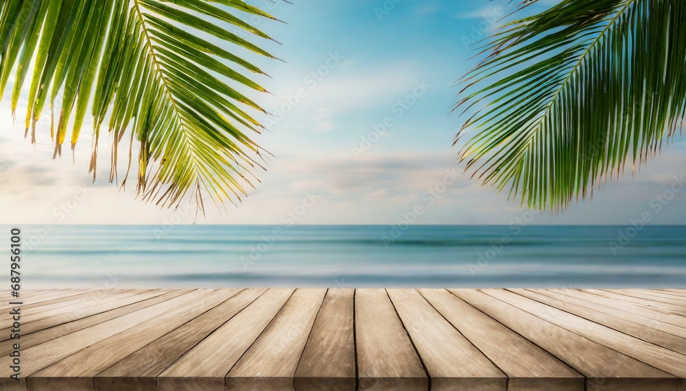 top of wood table with seascape and palm leaves blur bokeh light of calm sea and sky at tropical beach background empty ready for your product display montage summer vacation background concept