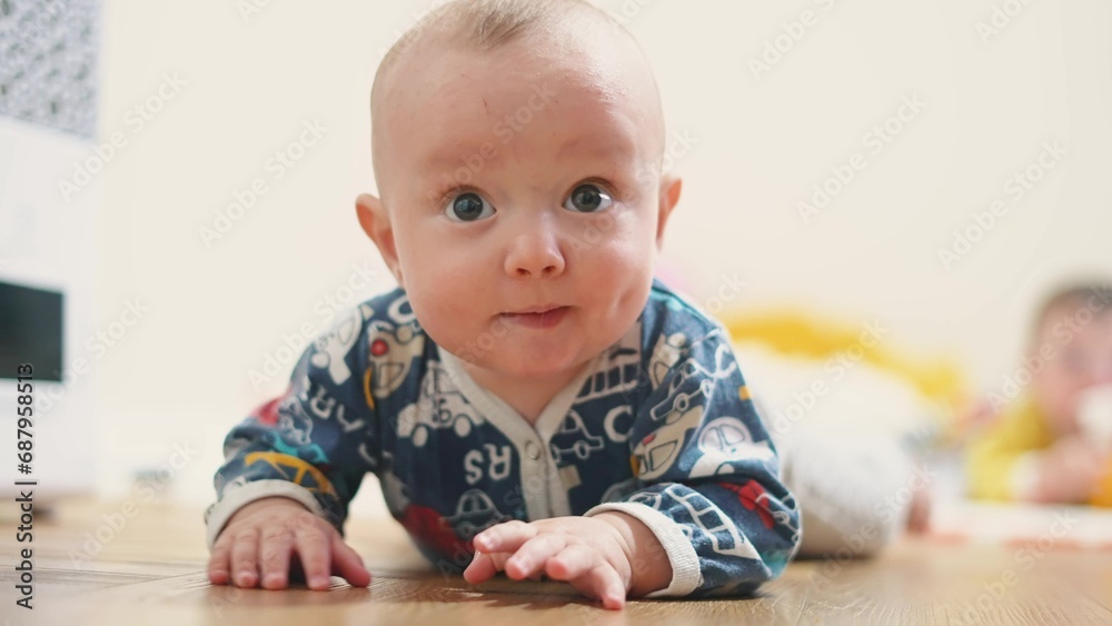 baby crawling. baby infant son makes the first move crawls on the floor for a toy. first steps happy family kid dream concept. son kid playing crawling in the room indoors at home baby crawling. baby infant son makes the first move crawls on the floor for a toy. first steps happy family kid dream concept. son kid playing crawling in the room indoors at home