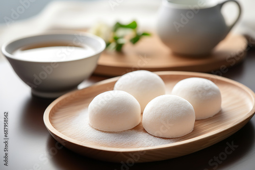  Traditional Japanese mochi being served, a rice dessert known for its soft, chewy texture, sweet simplicity, and delicate flavors.
