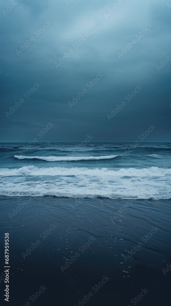 A Moody Monochromatic Background featuring a Vast, Empty Beach under a Gloomy Sky - Rough Sea Waves Crashing under the Dull Light - Beautiful Moody Wallpaper created with Generative AI Technology