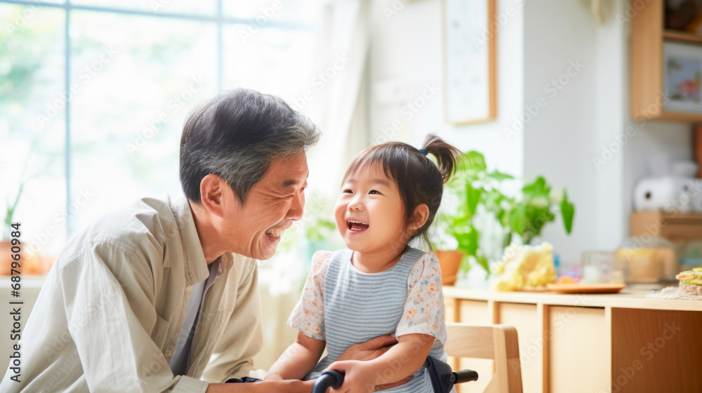 Senior Japanese man with a happy smiling child playing showing affection at home Senior Japanese man with a happy smiling child playing showing affection at home