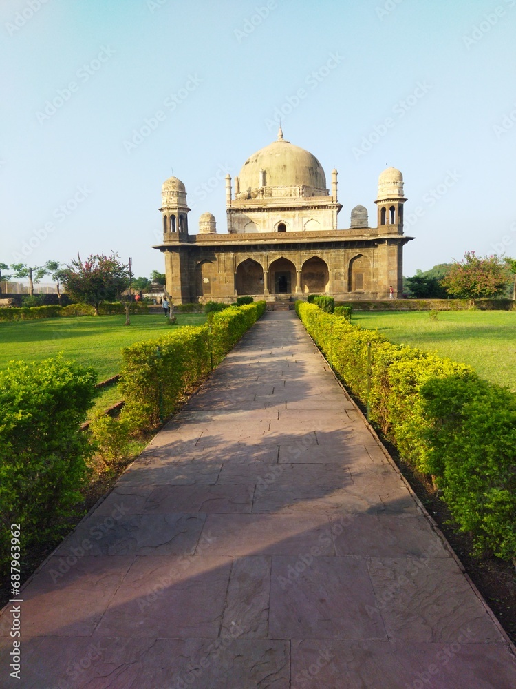 A beautiful view of tomb and green garden. Front view of 'black Tajmahal' tomb which is located in Burhanpur, Madhya Pradesh, India. Also known as kala Tajmahal.