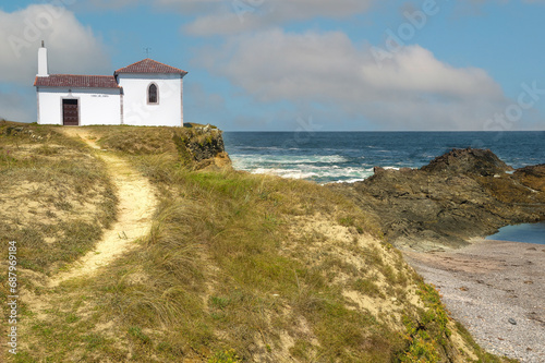 A ascending path to the small hermitage of the hill at the edge of the sea.