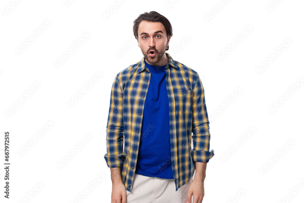 well-groomed brunette brutal man with a beard in a plaid shirt on a white background with copy space well-groomed brunette brutal man with a beard in a plaid shirt on a white background with copy space