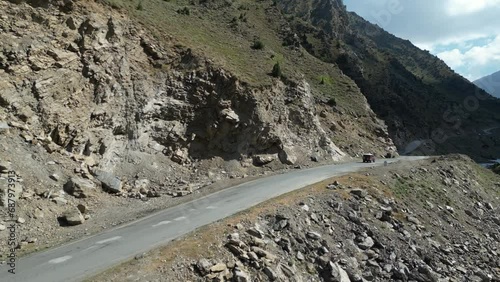 Aerial view of National Highway near Babusar Pass (13700ft) along with Kunhar river flowing and lush green fields on mountain slopes. Babusar pass connects Gilgit Baltistan with khyberpakhtunkhwa photo