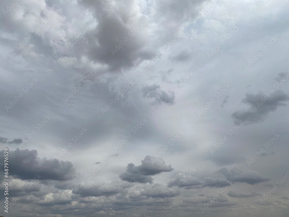 Blue and grey clouds in the overcast sky Blue and grey clouds in the overcast sky