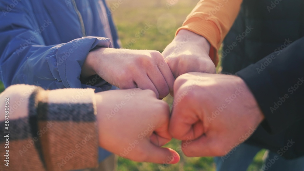 Fototapeta premium close-up fists a join together team. business team teamwork concept. close-up hands fists together group of people. team of young lifestyle tourists fists together success business concept