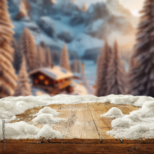 Wooden desk cover of snow flakes and blurred landscape of mountains. Cold december day. Empty space for your products. Mockup background and christmas time. Natural light. Snow and frost decoration. © magdal3na