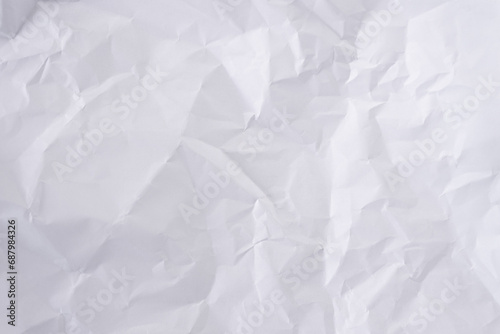 White crumpled paper texture background, clean white wrinkled paper, top view.