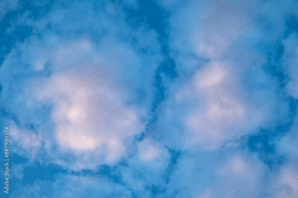Abstract White, Blue and Purple Alto Cumulus Clouds in the Sky at Dusk