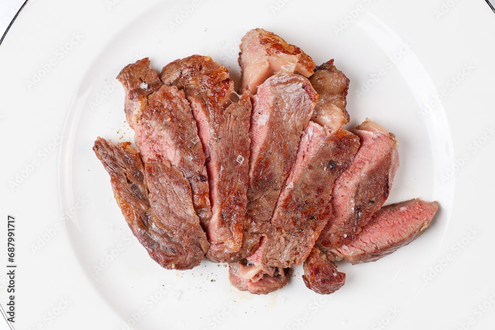 Beef entrecote steak. Close up photo with a dish made of beef entrecote medium rare steak. Barbecue steakhouse grill menu photo. white background Beef entrecote steak. Close up photo with a dish made of beef entrecote medium rare steak. Barbecue steakhouse grill menu photo. white background