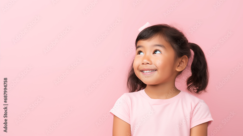 a little girl happy and smiling looking amazed, image on a pink background a little girl happy and smiling looking amazed, image on a pink background