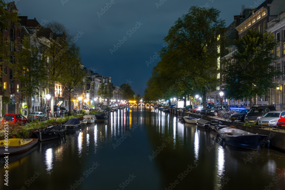 Amsterdam Canal at Night and Parked Boats and Cars