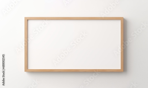 Blank wooden frame on a white wall. photo
