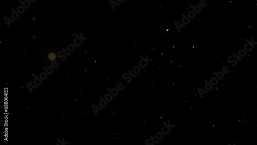 Dust particles overlay floating Glittering Particles with black background photo