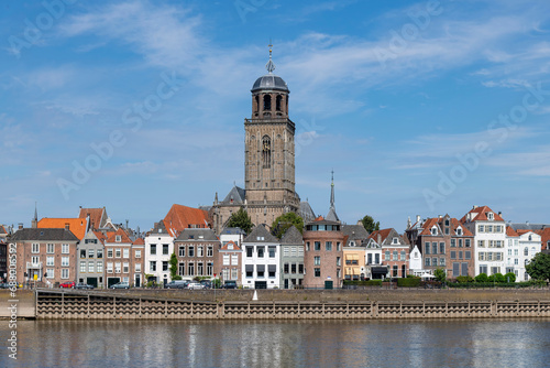 Panoramic view over the IJssel river towards the medieval city of Deventer, the Netherlands with in the middle the mains church of the city, the Great Church or St. Lebuinus Church