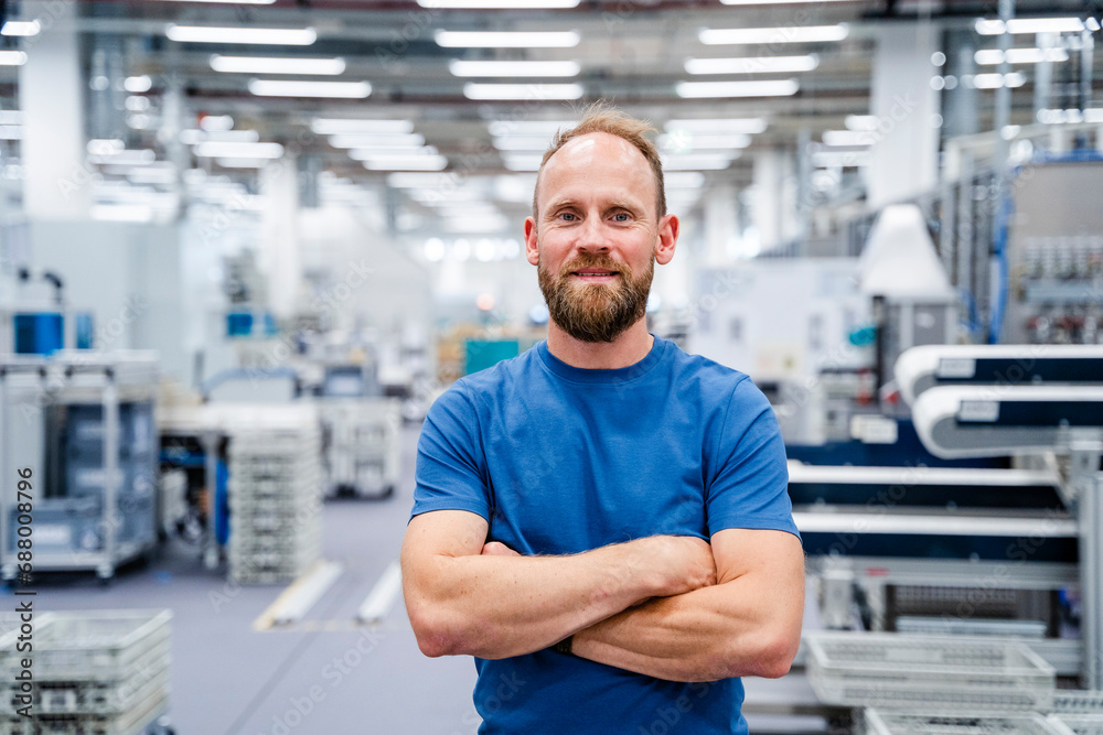 Portrait of a confident employee in a factory Portrait of a confident employee in a factory