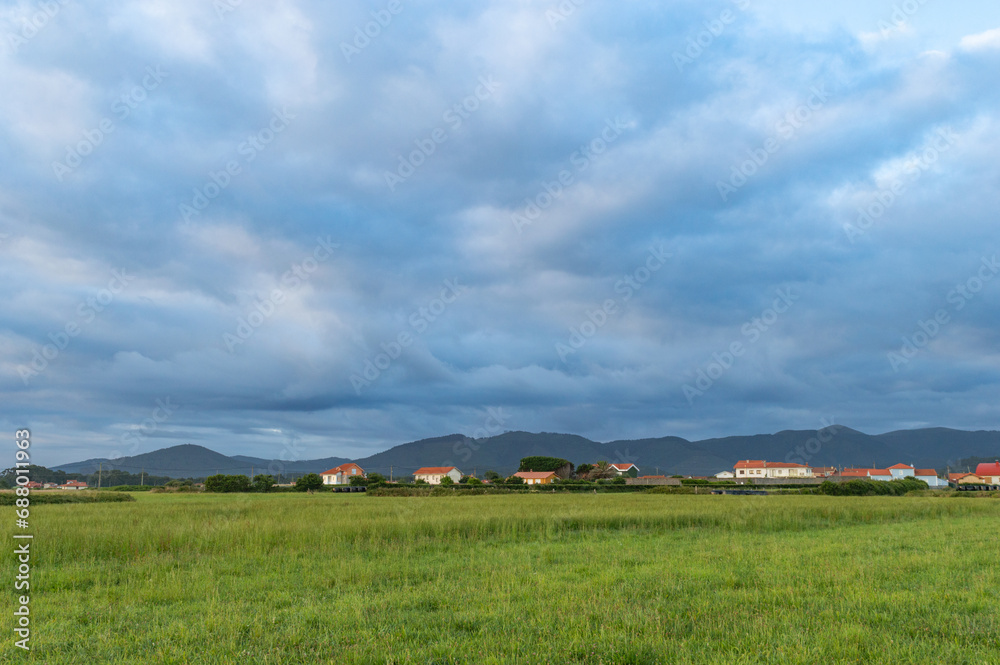 countryside landscape with cloudy sky