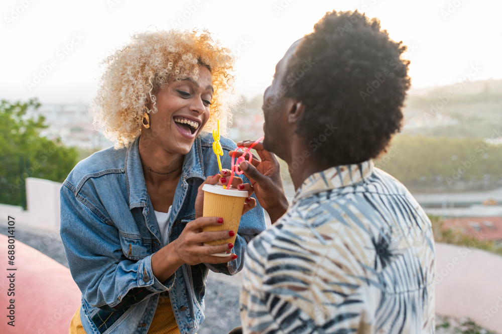 Happy transgender woman having juice with boyfriend Happy transgender woman having juice with boyfriend