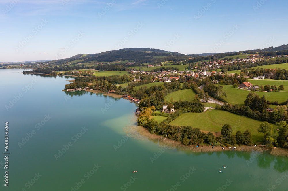 Austria, Upper Austria, Zell am Moos, Drone view of village on shore of Irrsee lake Austria, Upper Austria, Zell am Moos, Drone view of village on shore of Irrsee lake