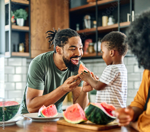 child family kitchen food boy son father mother watermelon fruit slice summer organic meal fun preparing healthy diet eating home black photo