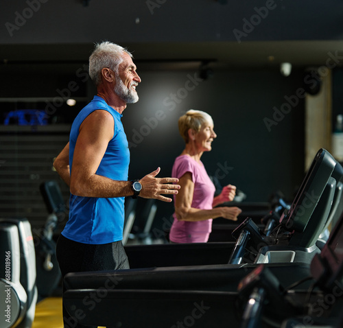 gym sport fitness exercising training mature man running cardio treadmill healthy active man adult woman equipment athletic couple run coach fit endurance