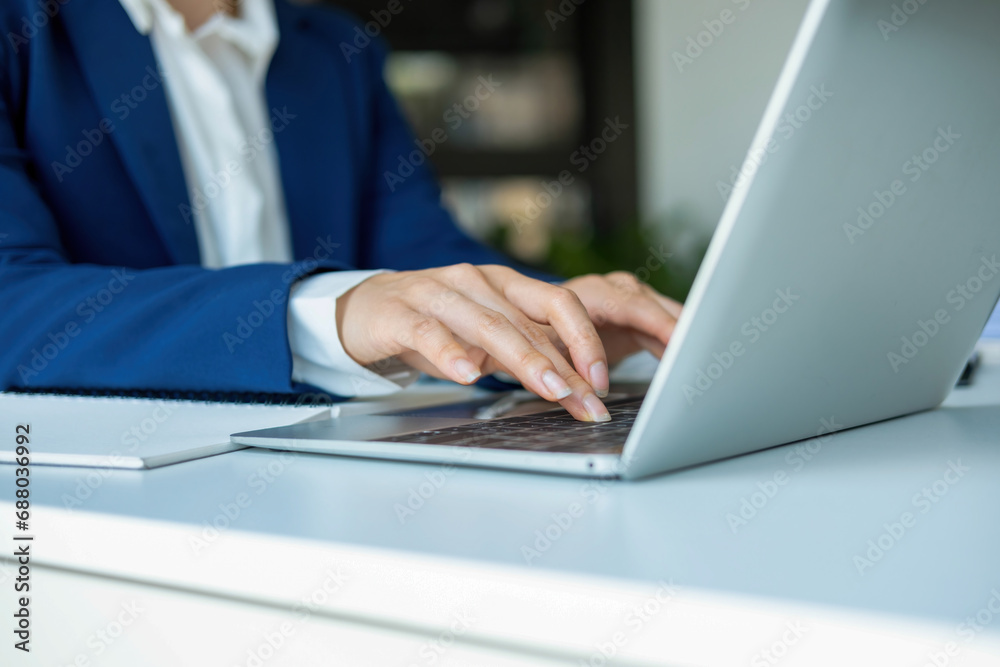 Busineswoman working by using laptop. Busineswoman working by using laptop.