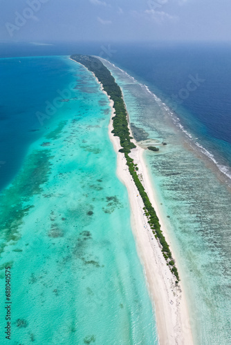 stunning blue ocean and sandy white island maldives top drone aeral view deserted hidden Maldives beach copyspace for text