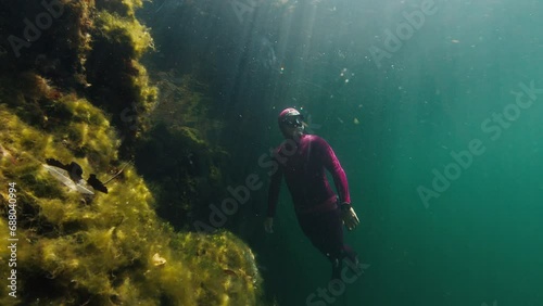 Wallpaper Mural Freediver swims underwater in the lake Torontodigital.ca